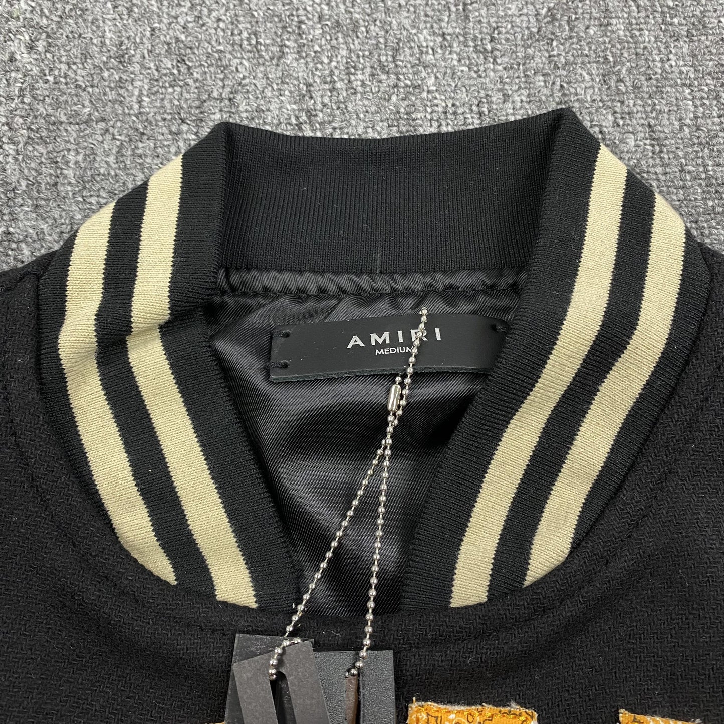 amiri-vintage-varsity-bomber-jacket-black-7-Drip Store Argentina