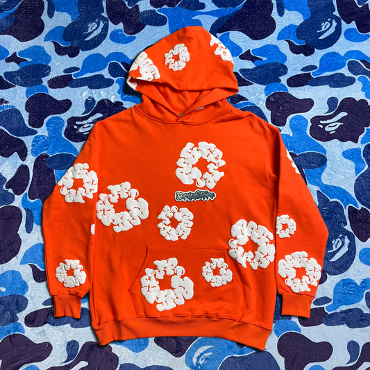 denim-tears-the-cotton-wreath-hoodie-orange-Drip Store Argentina