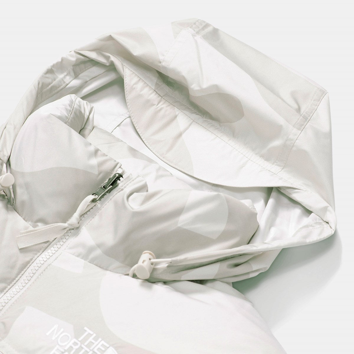 KAWS X THE NORTH FACE RETRO 1996 NUPTSE JACKET MOONLIGHT IVORY-Drip Store Argentina