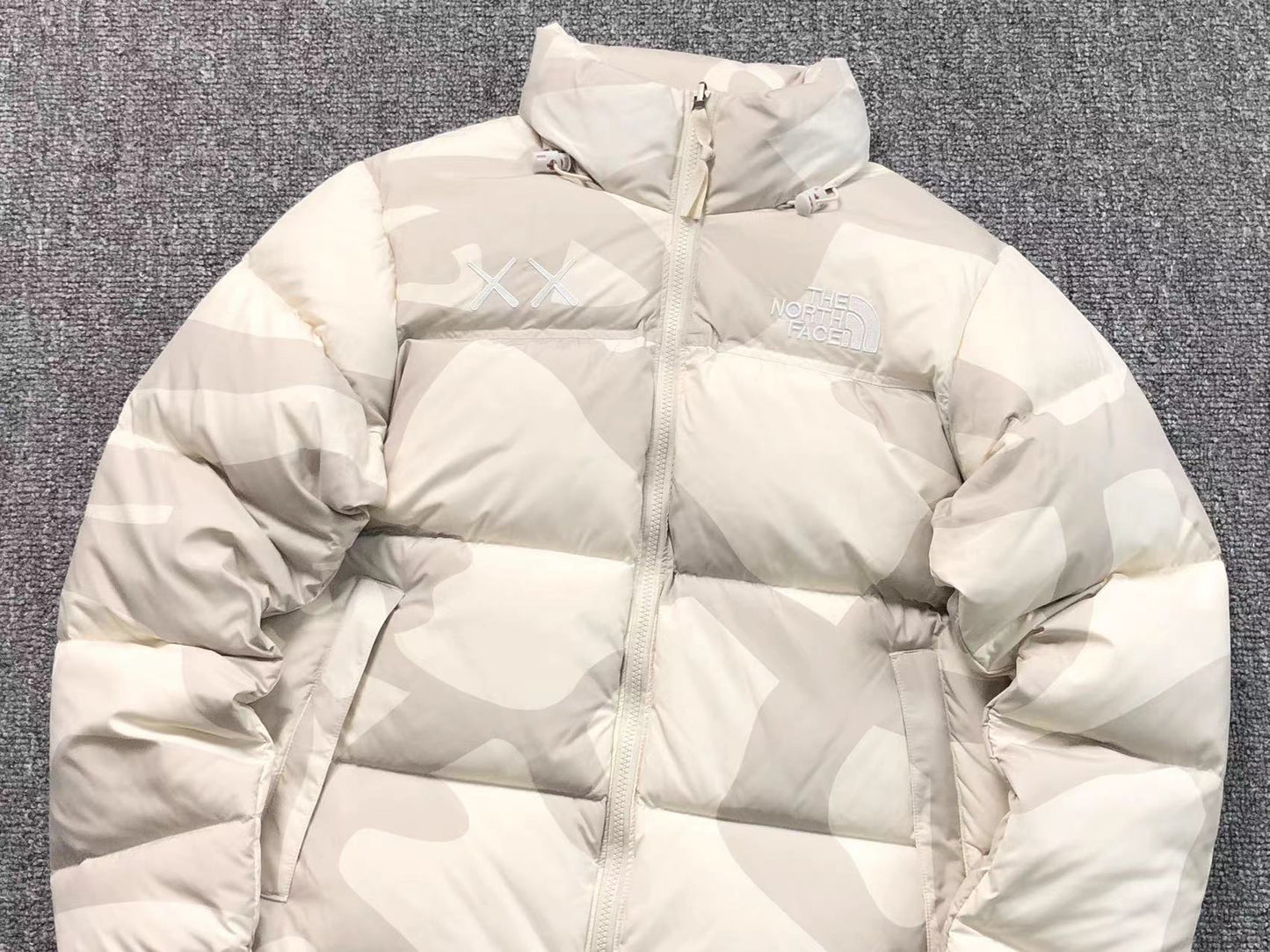 KAWS X THE NORTH FACE RETRO 1996 NUPTSE JACKET MOONLIGHT IVORY-Drip Store Argentina