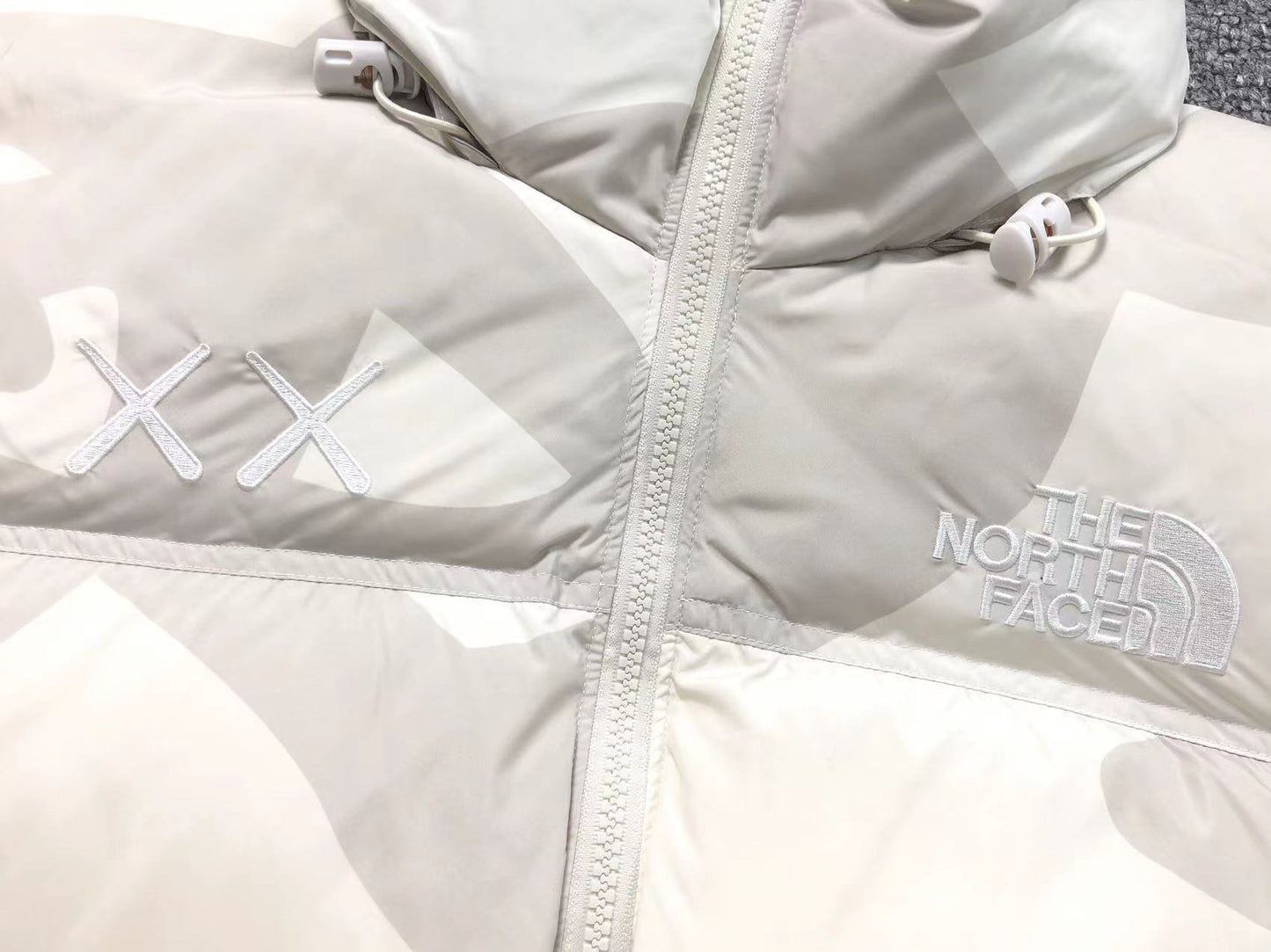KAWS X THE NORTH FACE RETRO 1996 NUPTSE JACKET MOONLIGHT IVORY-Drip Store Argentina