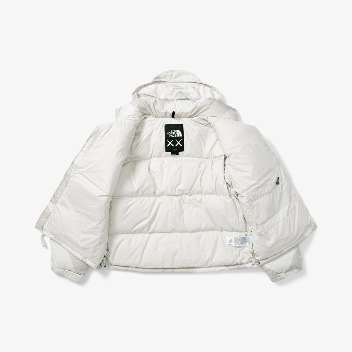 KAWS X THE NORTH FACE RETRO 1996 NUPTSE JACKET MOONLIGHT IVORY-Drip Store Argentina