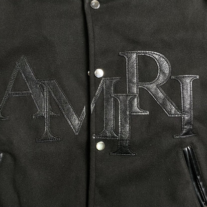 AMIRI STAGGERED LOGO VARSITY JACKET BLACK