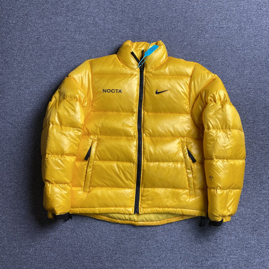 NIKE X NOCTA SUNSET PUFFER JACKET YELLOW