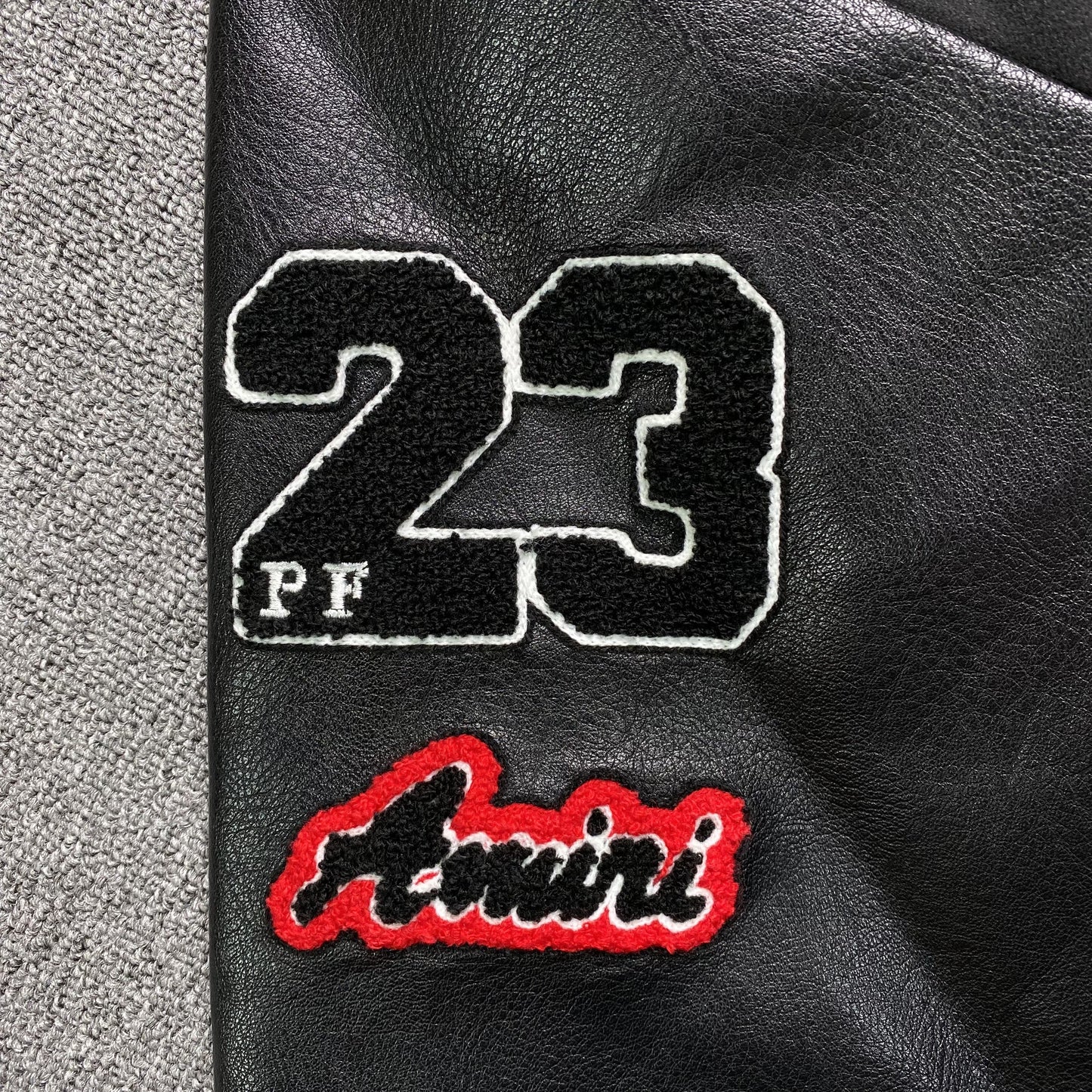 AMIRI LOGO PATCH VARSITY JACKET BLACK