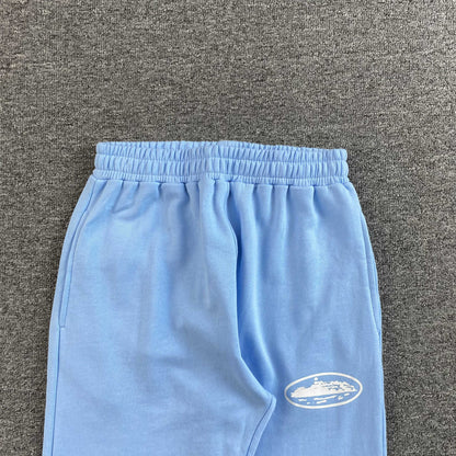 Corteiz Island Puff Print Open Hem Pants Baby Blue