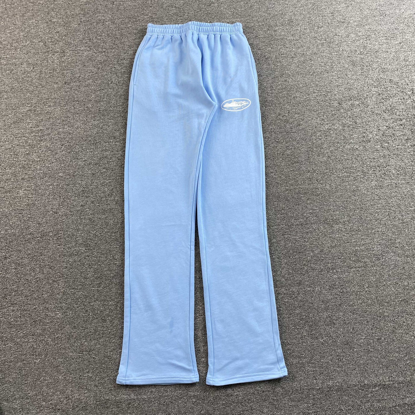 Corteiz Island Puff Print Open Hem Pants Baby Blue