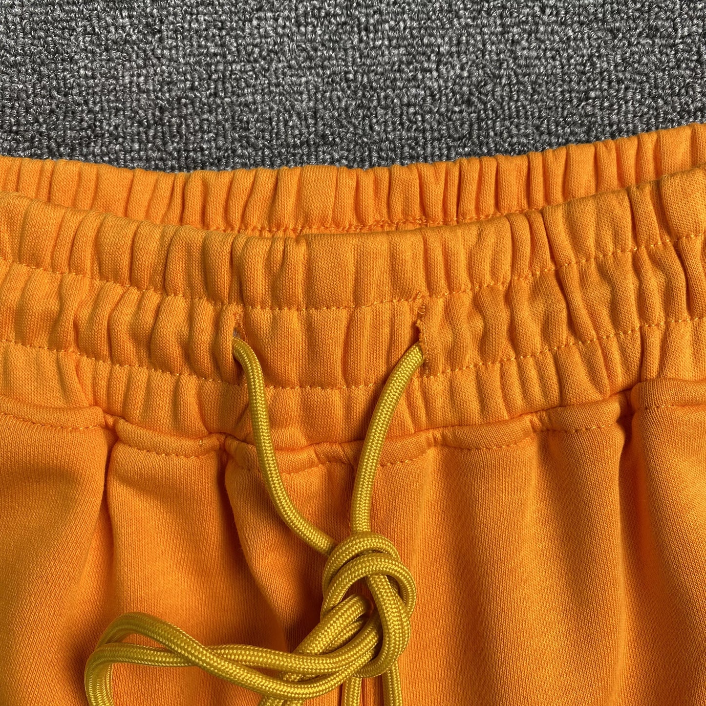 RHUDE X MCLAREN SHORTS ORANGE