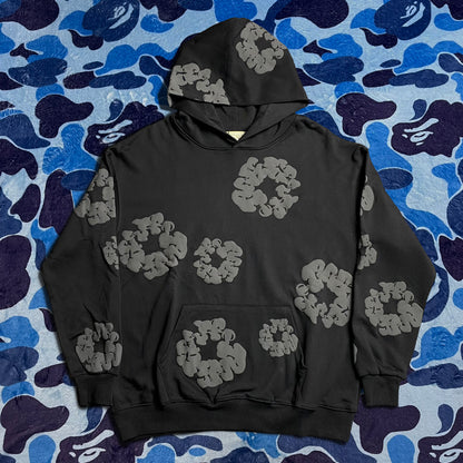 denim-tears-the-cotton-wreath-hoodie-black-monochrome-Drip Store Argentina