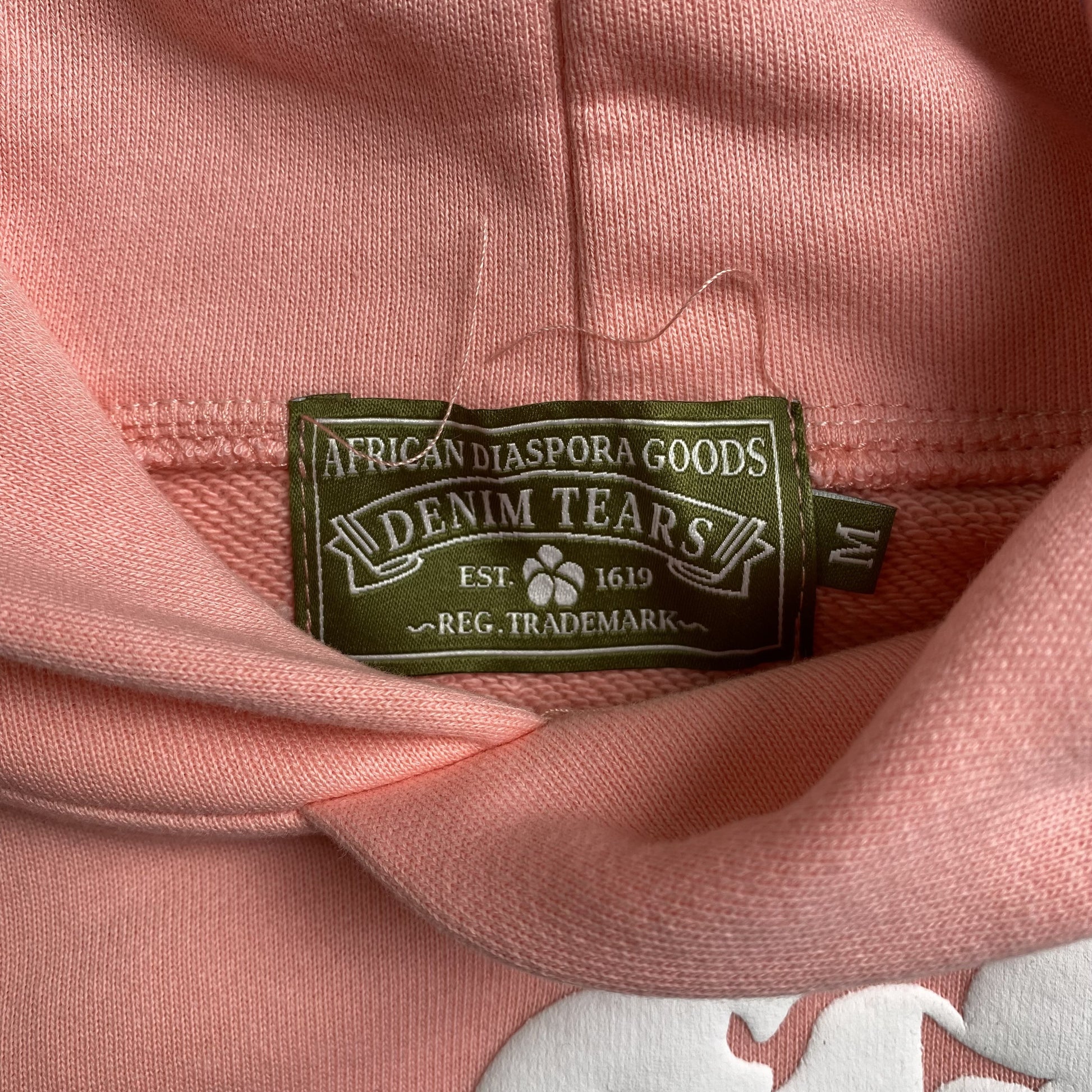 denim-tears-the-cotton-wreath-hoodie-pink-6-Drip Store Argentina