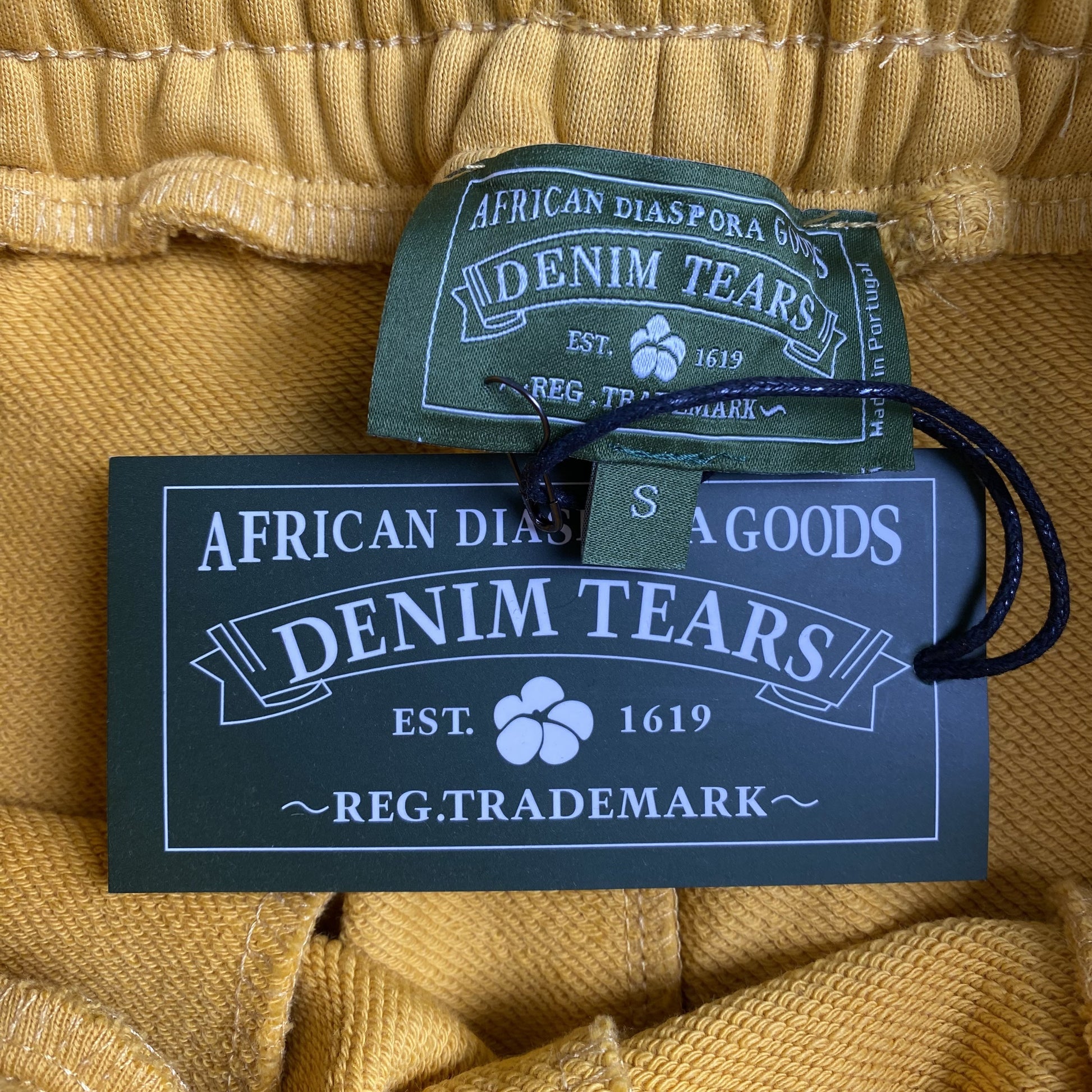 denim-tears-x-cpfm-cactus-tears-wreath-pants-yellow-7-Drip Store Argentina