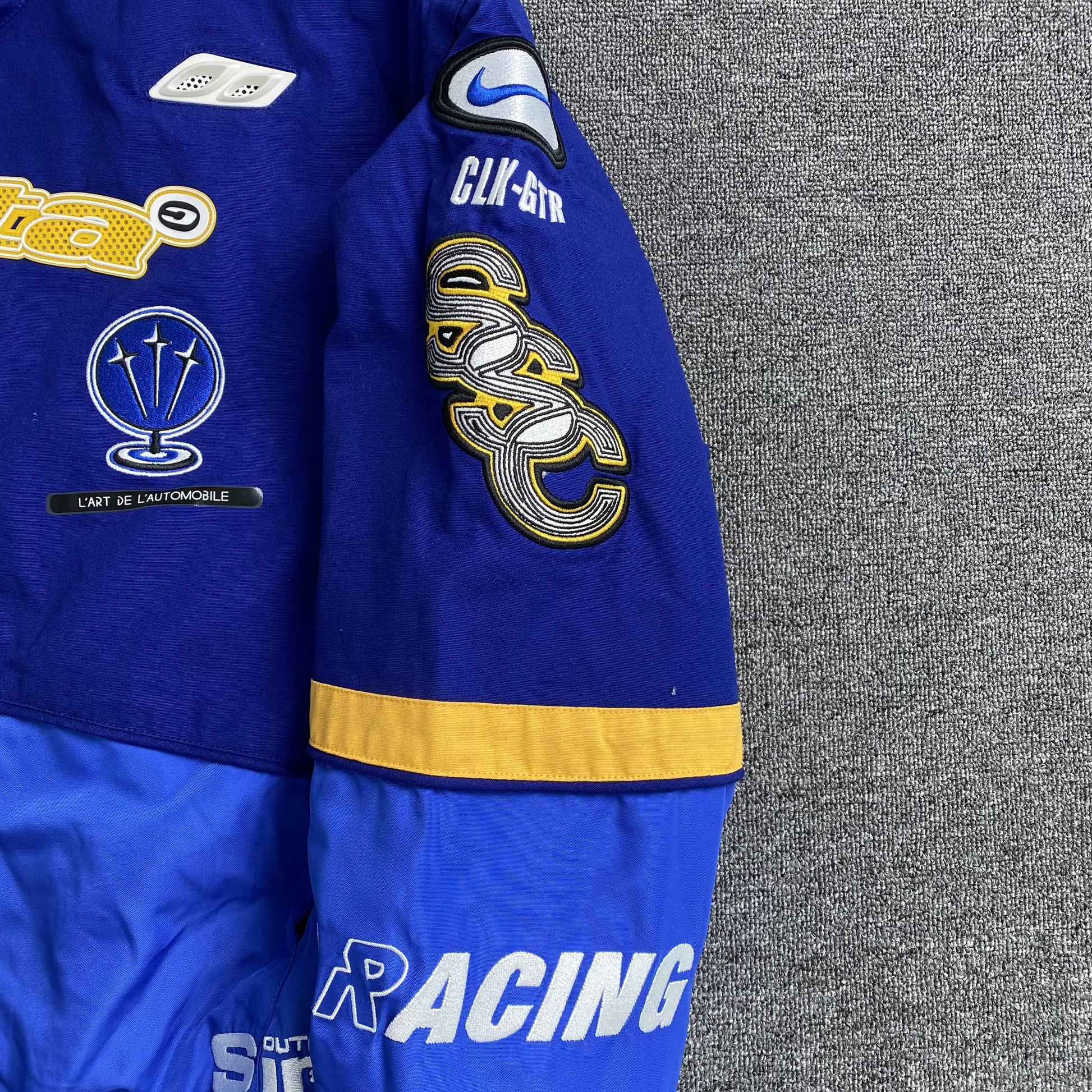nike-x-nocta-lart-racing-jacket-deep-royal-blue-13-Drip Store Argentina