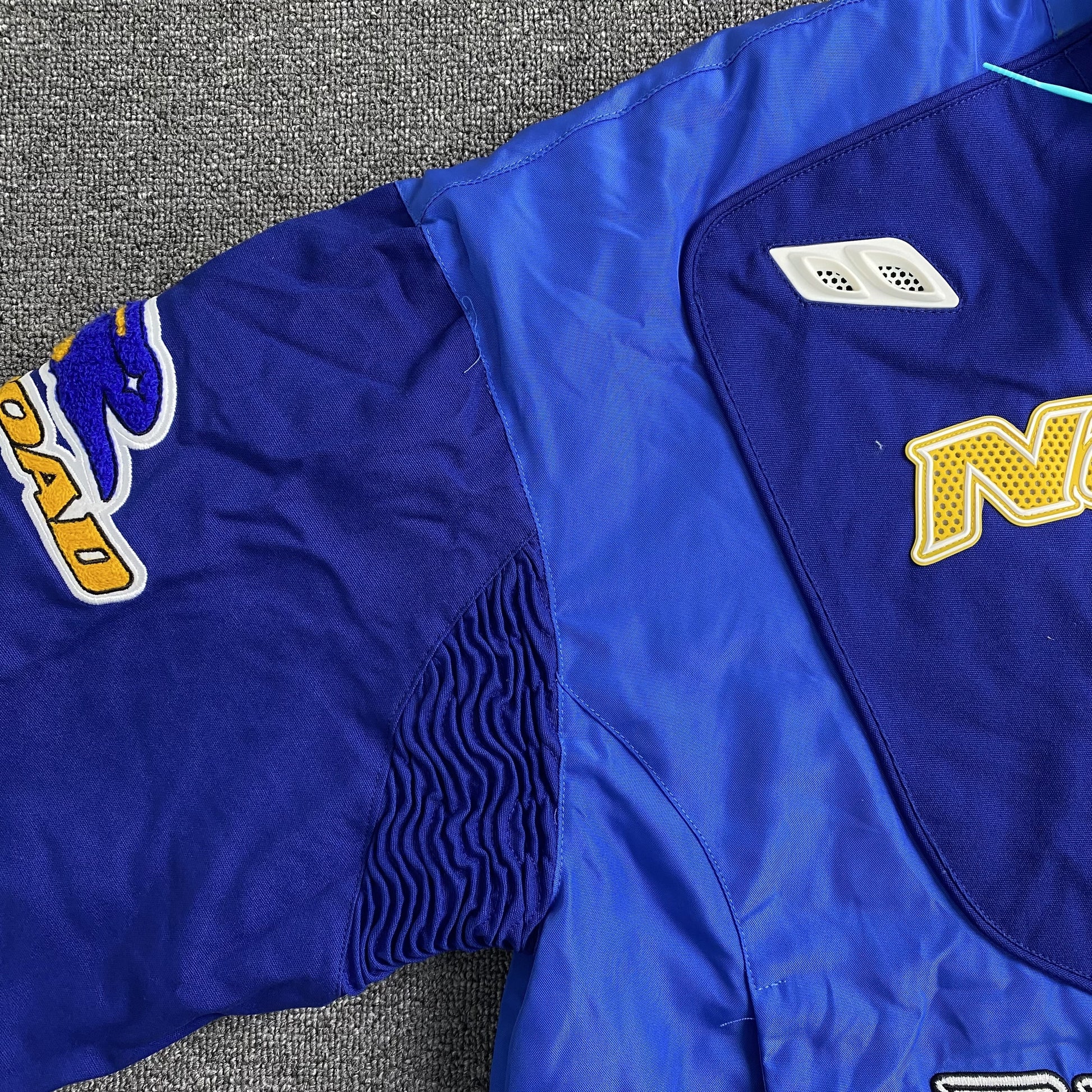 nike-x-nocta-lart-racing-jacket-deep-royal-blue-15-Drip Store Argentina