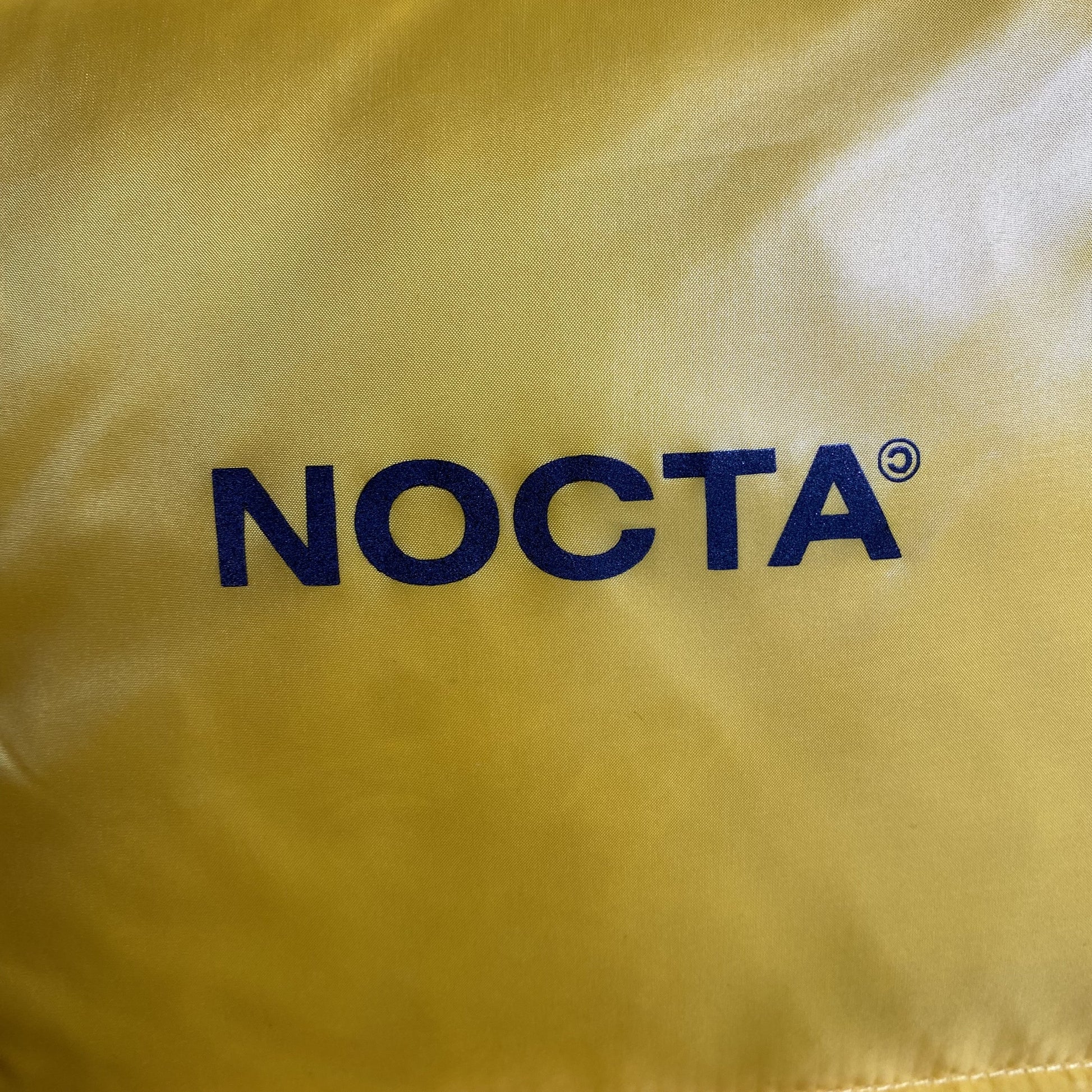 nike-x-nocta-sunset-puffer-jacket-yellow-12-Drip Store Argentina