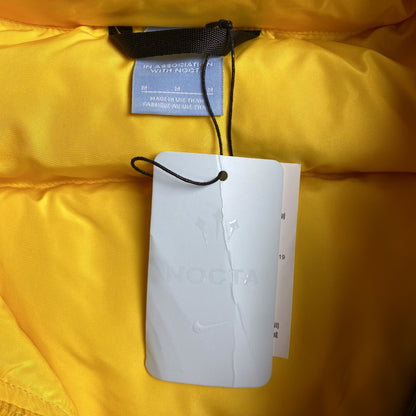 nike-x-nocta-sunset-puffer-jacket-yellow-7-Drip Store Argentina