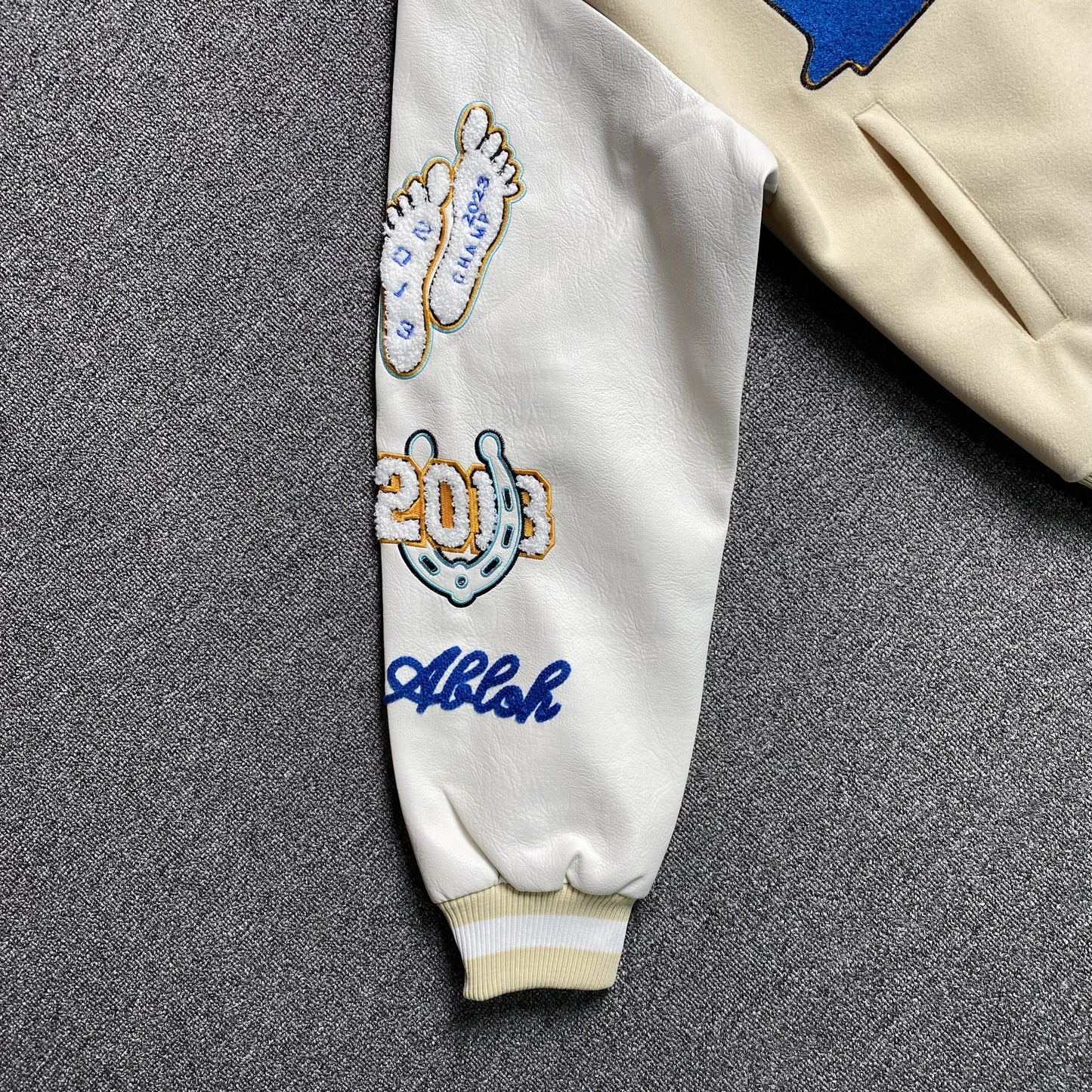 off-white-wo-thunderbolt-varsity-jacket-neutrals-8-Drip Store Argentina